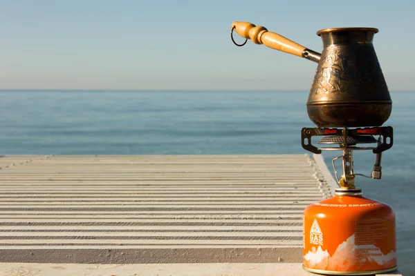 Turk with coffee on a gas burner — Stock Photo, Image