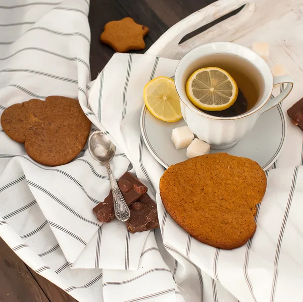 Homemade cookies and nuts with a cup of tea — Stock Photo, Image