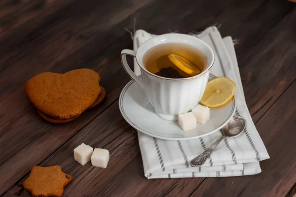 Homemade cookies and nuts with a cup of tea — Stock Photo, Image