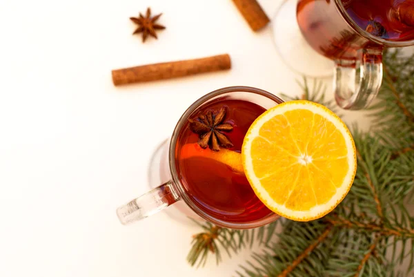 Glass of mulled wine with cinnamon and anise star