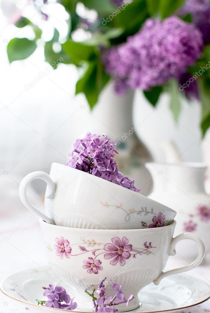 sprig of lilac in a cup