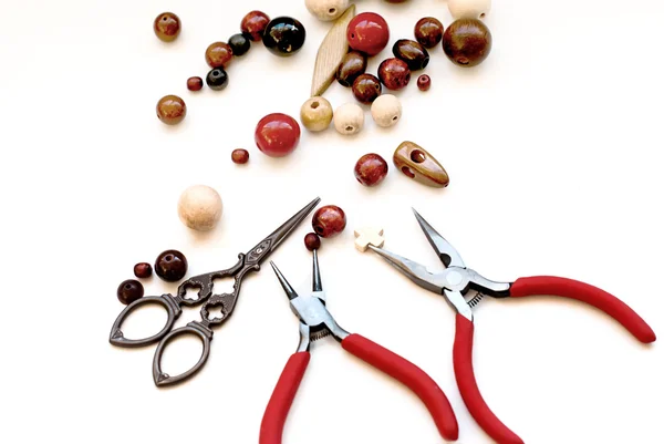 Wooden beads and tools for creating fashion jewelry in the manuf — Stock Photo, Image