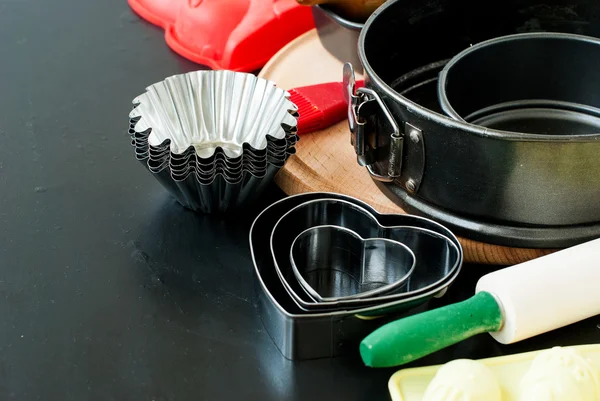 Appliances for baking closeup on wooden background — Stock Photo, Image