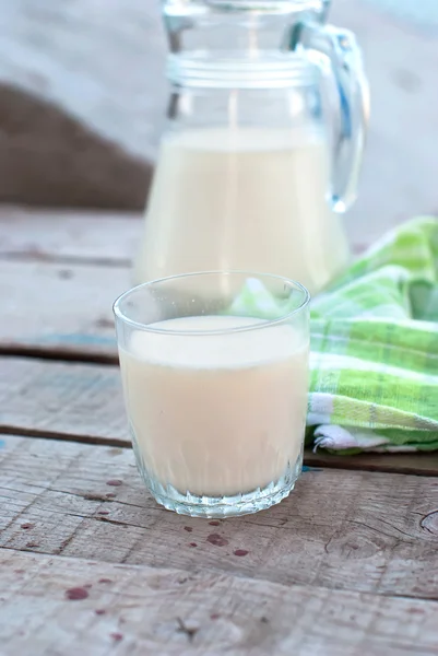 glass of milk and a jug of milk