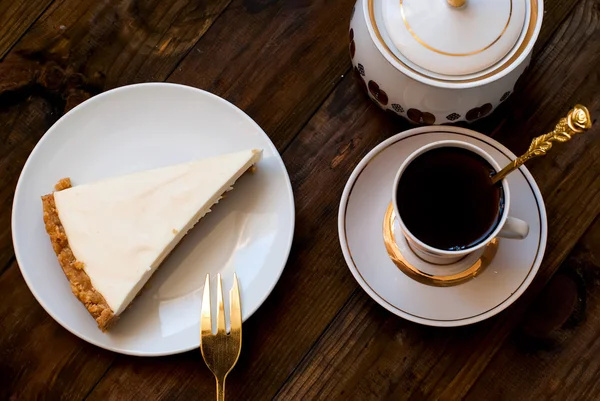 Cheesecake and a cup of coffee, top view — Stok fotoğraf