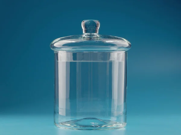 glass jar for bulk products on a blue background