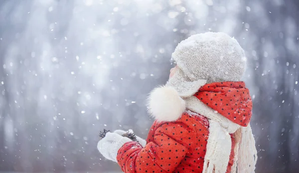 Little Girl Orange Jacket Wool Hat Walks Snow Sled Lollipop Stock Picture