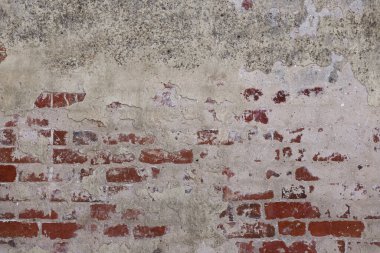 Eski alçı ve boya katmanlı eski tuğla duvar, arka plan