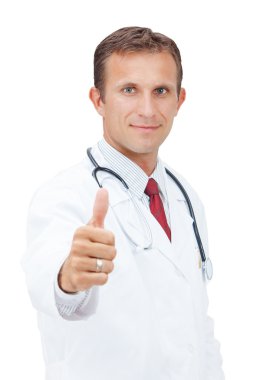 Smiling Medical doctor express happiness with thumb up.