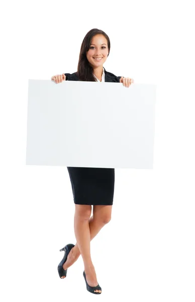 Young woman holding at blank card in her hand — Stock Photo, Image