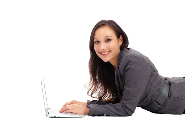 Closeup of young lady using laptop computer — ストック写真