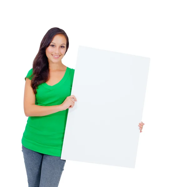 Beautiful caucasian woman holding a blank sign — Stockfoto