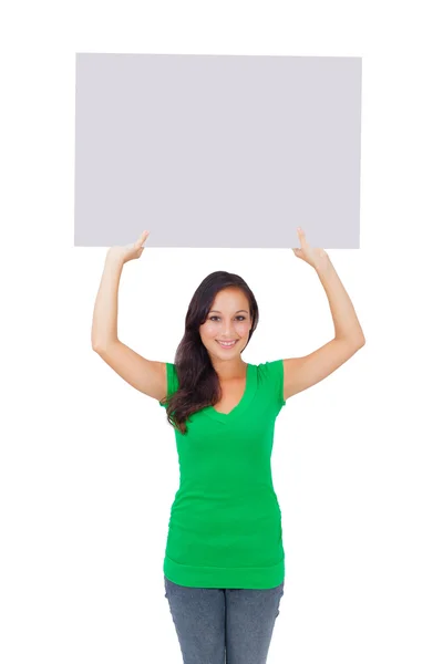 Beautiful caucasian woman holding a blank sign — Zdjęcie stockowe