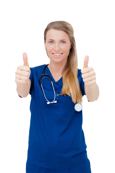 Mujer doctora de uniforme mostrando un signo de éxito, después de un éxito —  Fotos de Stock