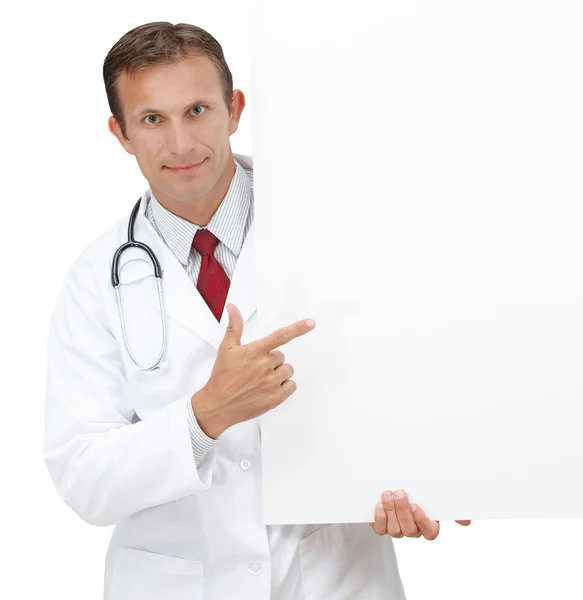 Happy doctor showing blank clipboard sign.