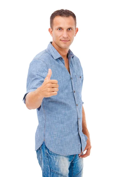 Happy young man giving you the thumbs up — Stockfoto