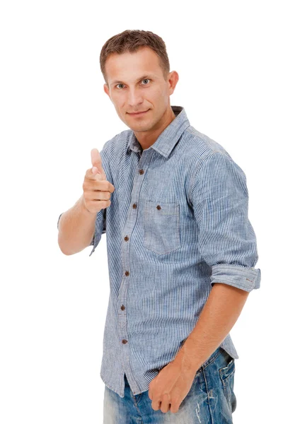 A young man pointing at something and laughing — Stockfoto