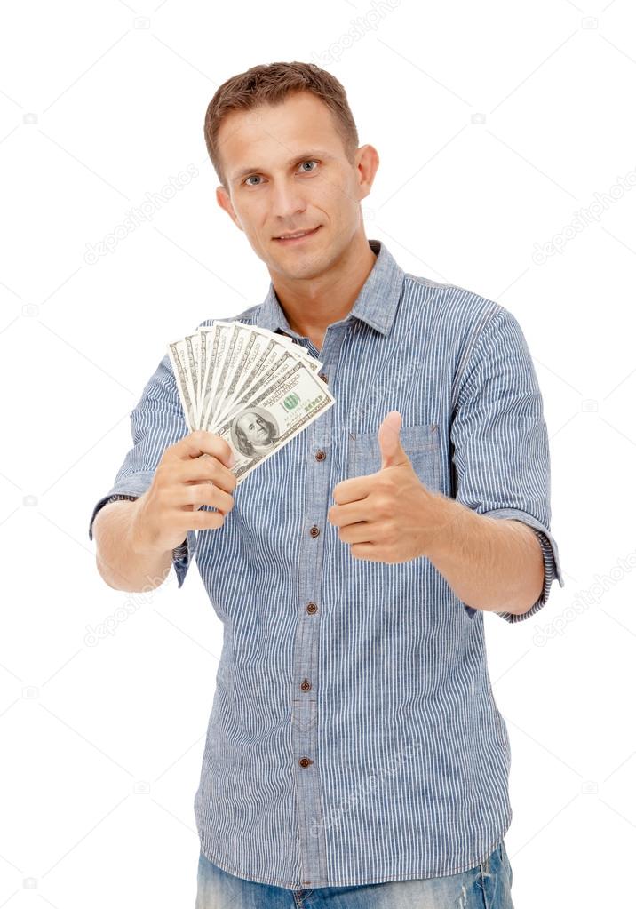 A young man holding a wad of cash up in his fist