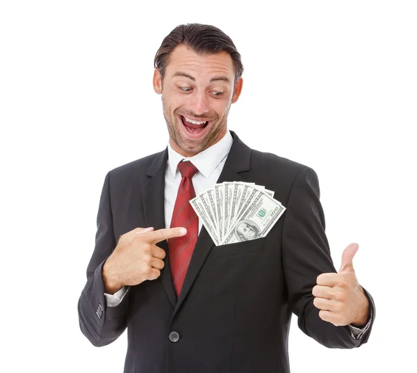 Sonriente hombre de negocios guapo sosteniendo dinero —  Fotos de Stock