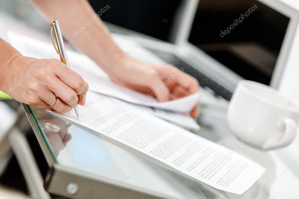 Paperwork -  secretary s hands doing paperwork