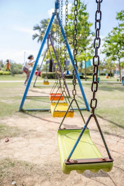 old playground swings in the park