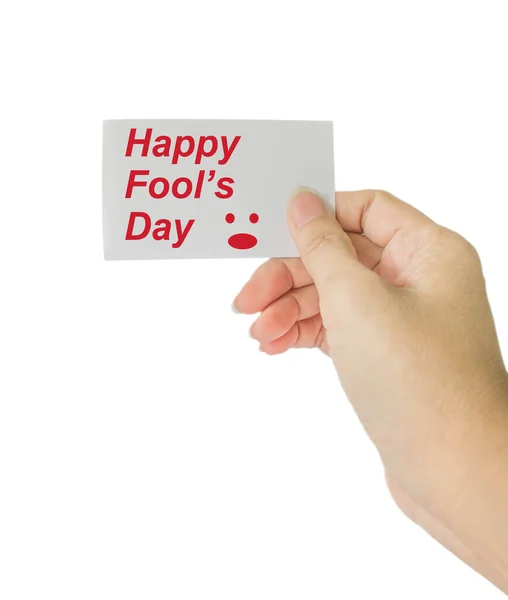 Mão Segurar Cartão Com Palavra Feliz Dia Tolo Fundo Branco — Fotografia de Stock