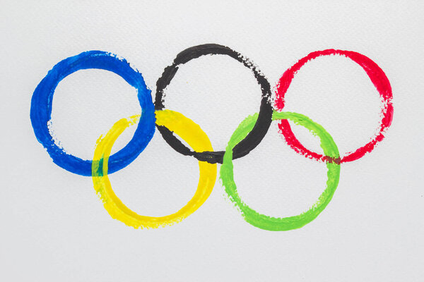 Olympic Rings water color paint on white rough paper