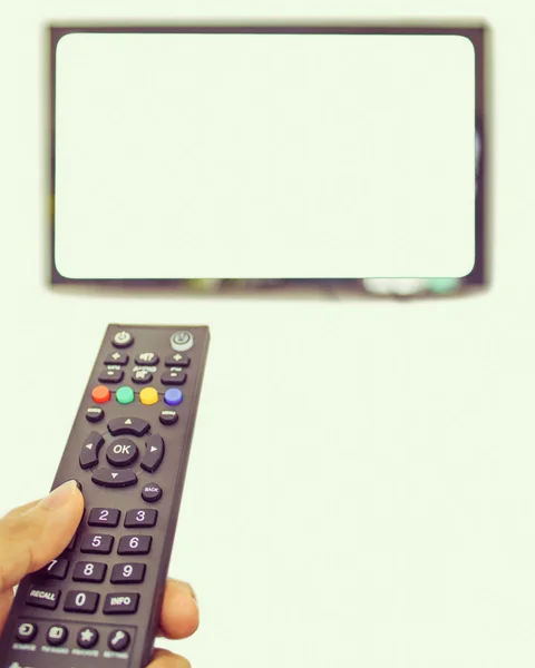 Channel surfing with remote control — Stock Photo, Image