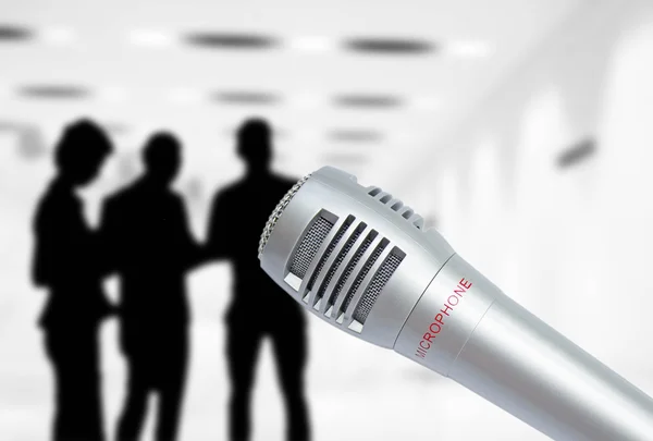 Wireless microphone on background of people — Stock Photo, Image