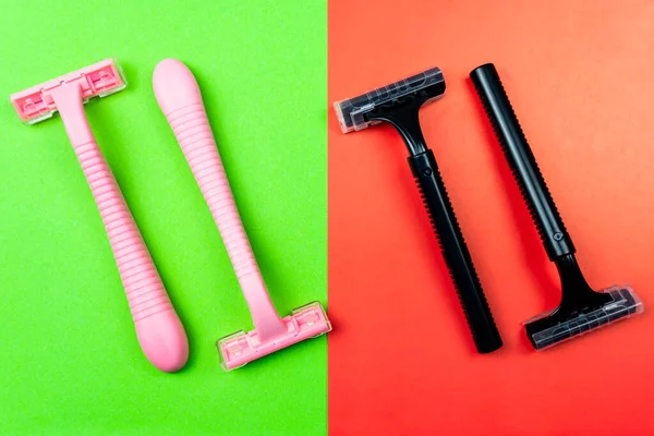 Gender inequality and stereotypes. The division of the sexes into men and women. Image of shaving razors in pink and black on a green and red background