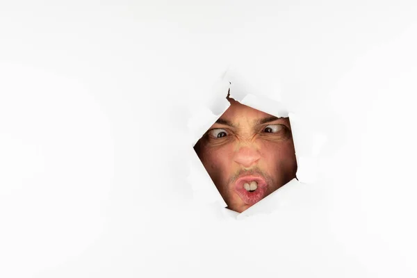 Man Makes Face Hole White Wall Free Space Text — Stock Photo, Image