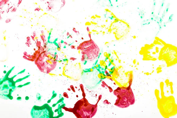 Handprints of different colors on white paper. Multicolor hand prints Handprints made by children.