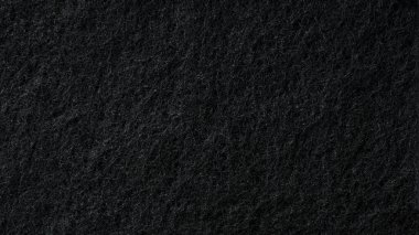 Arka plan olarak siyah sünger dokusu. Soyut siyah arkaplan. yakın plan