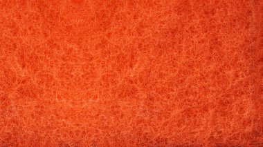 Kırmızı sünger dokusu arka planda. Soyut kırmızı arkaplan. Yakın plan.