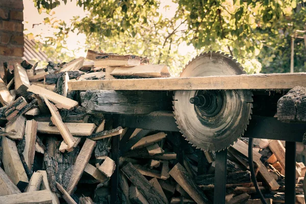 circular power saw for cutting wood. circular saw blade on a wooden machine. preparation of firewood
