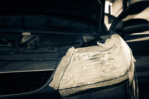 headlight cleaning. white paste polish all over the headlight. polishing