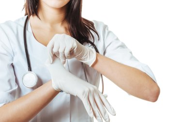 Doctor putting on white sterilized medical glove for making operation. woman wears latex surgical gloves clipart