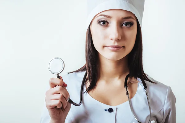 Smiling medical doctor woman with stethoscope. Isolated over white background — Stock Photo, Image