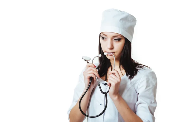 Female doctor with stethoscope, standing isolated on white background. — Stock Photo, Image