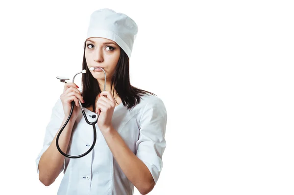 Female doctor with stethoscope, standing isolated on white background. — Stock Photo, Image