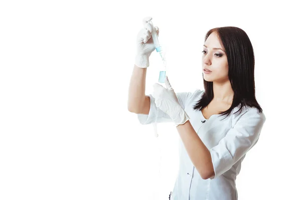 Young brunette doctor woman with syringe isolated on white — Stock Photo, Image