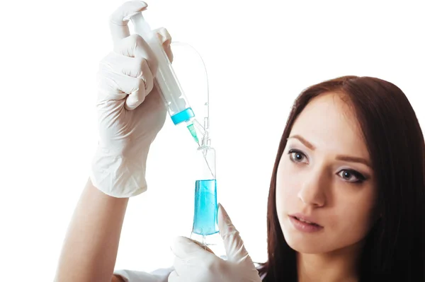 Young brunette doctor woman with syringe isolated on white — Stock Photo, Image