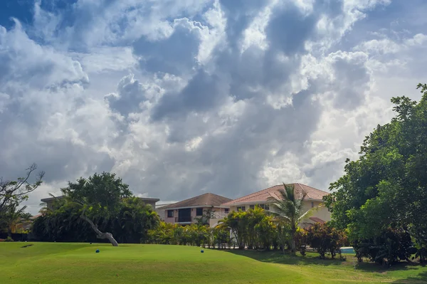 Golf course in Dominican republic. field of grass and coconut palms on Seychelles island. — Stock Photo, Image