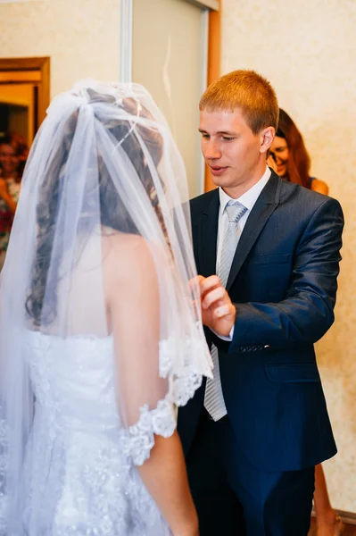 Handsome groom first time meets his bride at her house on a wedding day. — Stock Photo, Image