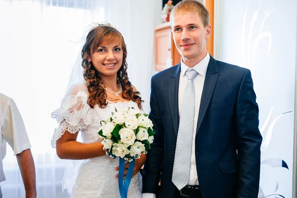 Handsome groom first time meets his bride at her house on a wedding day. — Stock Photo, Image