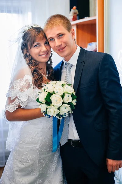 Handsome groom first time meets his bride at her house on a wedding day. — Stock Photo, Image