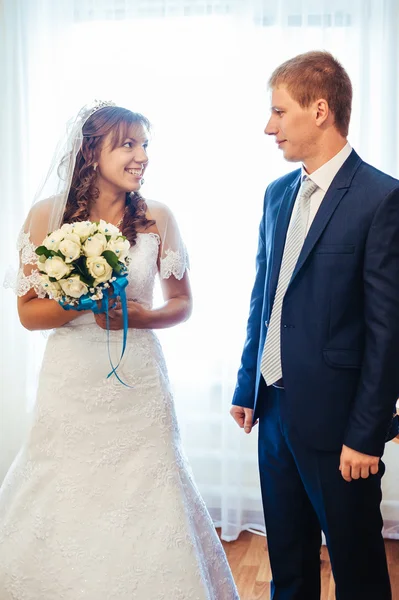 Handsome groom first time meets his bride at her house on a wedding day. — Stock Photo, Image