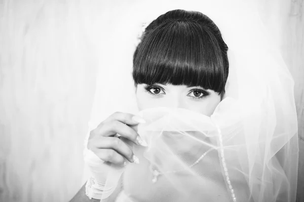 Beautiful bride getting ready in white wedding dress with hairstyle and bright makeup. Happy sexy girl waiting for groom. Romantic lady in bridal dress have final preparation for wedding. — Stock Photo, Image