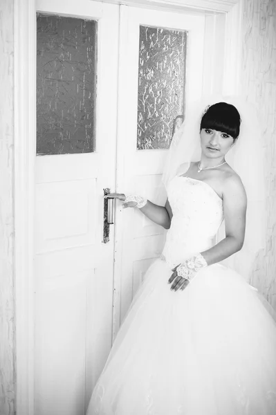 Beautiful bride getting ready in white wedding dress with hairstyle and bright makeup. Happy sexy girl waiting for groom. Romantic lady in bridal dress have final preparation for wedding. — Stock Photo, Image