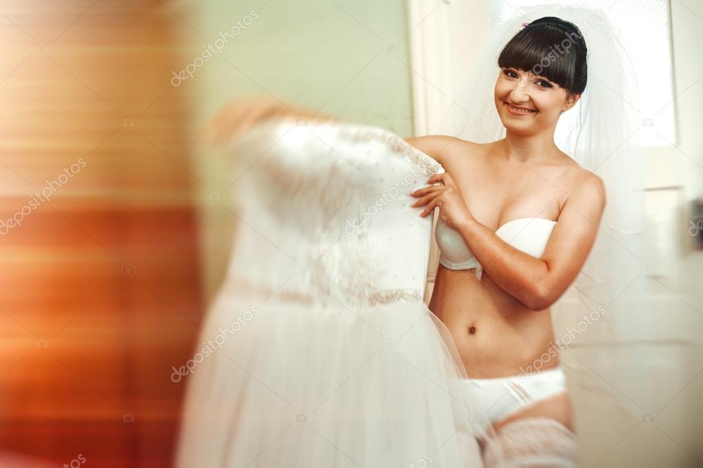 Beautiful Bride Getting Ready In White Wedding Dress With